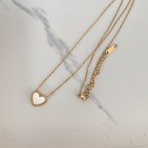 Two sided heart necklace. One side is mop. 14k gold filled.